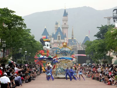 Floats and a huge Mickey Mouse is on parade at Hong Kong Disneyland Saturday, Sept. 11, 2005, one day before its official opening. It is Disney's first-ever vacation resort in China. (AP Photo/Vincent Yu)