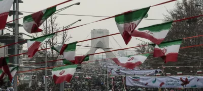 ﻿11 February 2019, Iran, Tehran: People gather in front of the Azadi Tower at the Azadi Square during a ceremony marking the 40th anniversary of the Iranian Islamic Revolution. Photo: Saeid Zareian/dpa