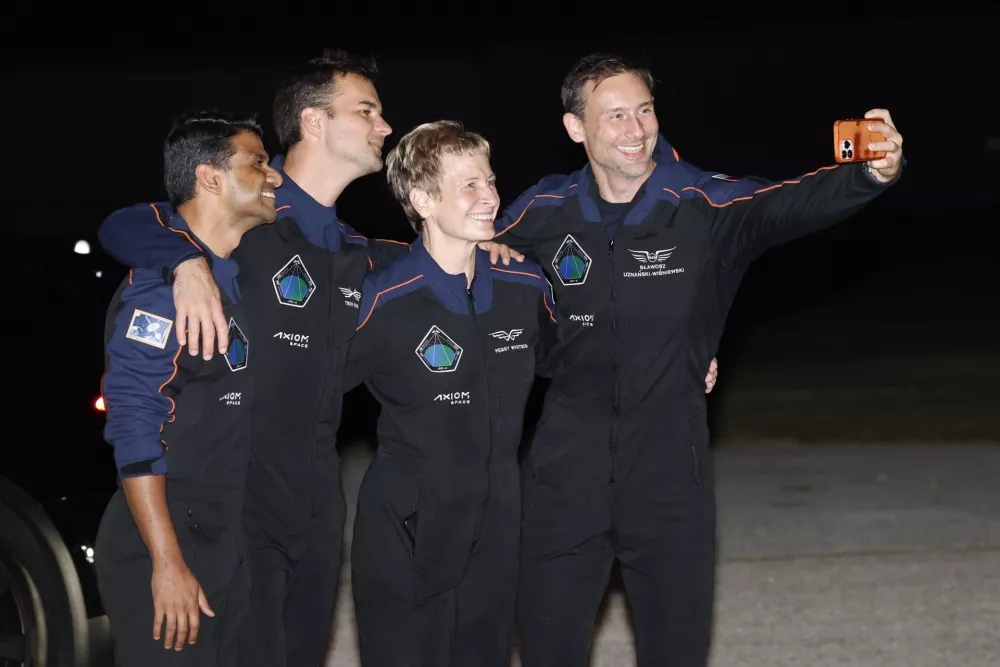 SpaceX Falcon 9 crew pose for a selfie before departing for a launch to the International Space Station at the Kennedy Space Center in Cape Canaveral, Fla., Tuesday, June 24, 2025. (AP Photo/Terry Renna)