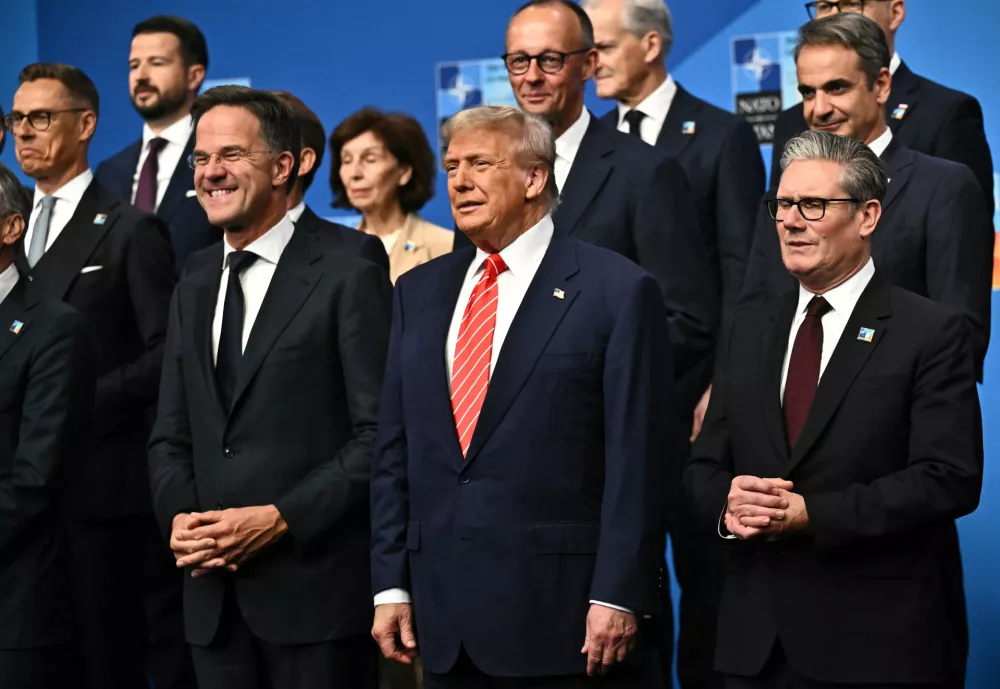 NATO Secretary General Mark Rutte, from left, President Donald Trump and Britain's Prime Minister Keir Starmer pose with NATO country leaders for a family photo during the NATO summit in The Hague, Netherlands, Wednesday, June 25, 2025. (Ben Stansall/Pool Photo via AP)
