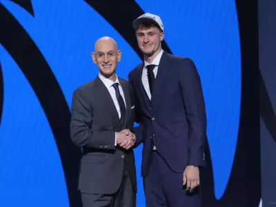 Jun 25, 2025; Brooklyn, NY, USA; Cooper Flagg poses with NBA commissioner Adam Silver after being selected as first overall by the Dallas Mavericks in the first round of the 2025 NBA Draft at Barclays Center. Mandatory Credit: Brad Penner-Imagn Images
