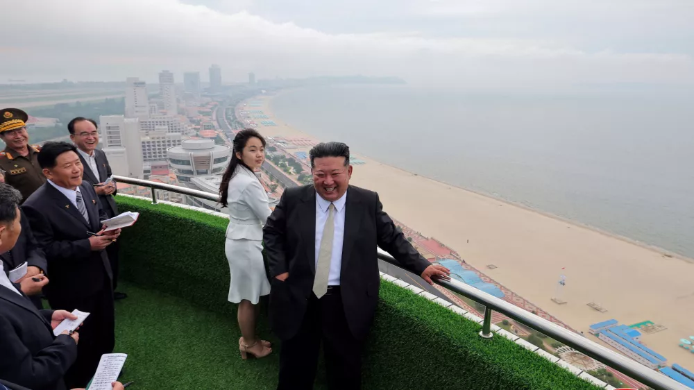 North Korean leader Kim Jong Un and his daughter Kim Ju Ae stand on a balcony facing the beach during a ceremony to celebrate the completion of the Wonsan Kalma Coastal Tourist Zone, in Wonsan, in North Korea, June 24, 2025. KCNA via REUTERS  ATTENTION EDITORS - THIS IMAGE WAS PROVIDED BY A THIRD PARTY. REUTERS IS UNABLE TO INDEPENDENTLY VERIFY THIS IMAGE. NO THIRD PARTY SALES. SOUTH KOREA OUT. NO COMMERCIAL OR EDITORIAL SALES IN SOUTH KOREA.   TPX IMAGES OF THE DAY