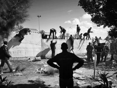 Tunisian, Egyptian and other nationals flee Libya during fighting between rebels and pro Qaddafi forces and arrive at the border crossing in Ras Jdir near Ben Gardenne, Tunisia. 2011