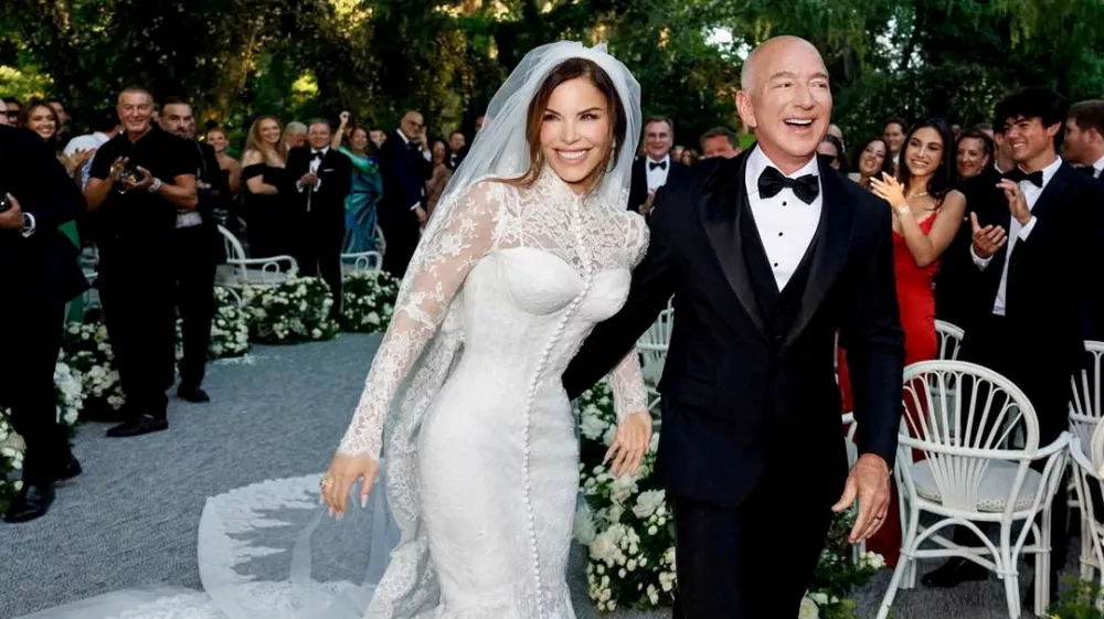Amazon Founder Jeff Bezos and Media Personality Lauren Sanchez Bezos react on the day of their wedding in Venice, Italy, June 27, 2025 in this picture obtained from social media. @laurensanchezbezos via Instagram/via REUTERS THIS IMAGE HAS BEEN SUPPLIED BY A THIRD PARTY. MANDATORY CREDIT. NO RESALES. NO ARCHIVES.   TPX IMAGES OF THE DAY