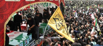 People attend the funeral procession of Iranian military commanders, nuclear scientists and others killed in Israeli strikes, in Tehran, Iran, June 28, 2025. Majid Asgaripour/WANA (West Asia News Agency) via REUTERS  ATTENTION EDITORS - THIS PICTURE WAS PROVIDED BY A THIRD PARTY