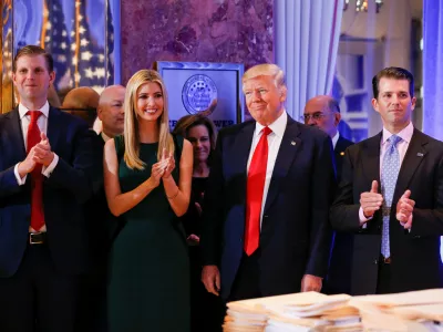 ﻿U.S. President-elect Donald Trump (C) smiles as he is applauded by his son Eric Trump (L) daughter Ivanka and son in law Jared Kushner (R) ahead of a press conference in Trump Tower, Manhattan, New York, U.S., January 11, 2017. REUTERS/Shannon Stapleton