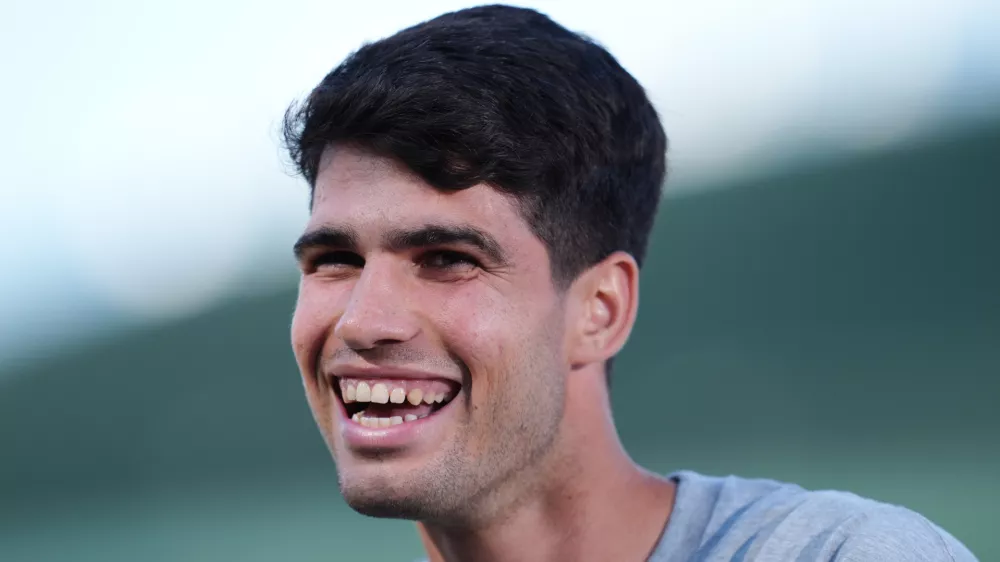 28 June 2025, United Kingdom, London: Spanish tennis player Carlos Alcaraz speaks to the media at the All England Lawn Tennis and Croquet Club in Wimbledon ahead of the Wimbledon Championships. Photo: John Walton/PA Wire/dpa