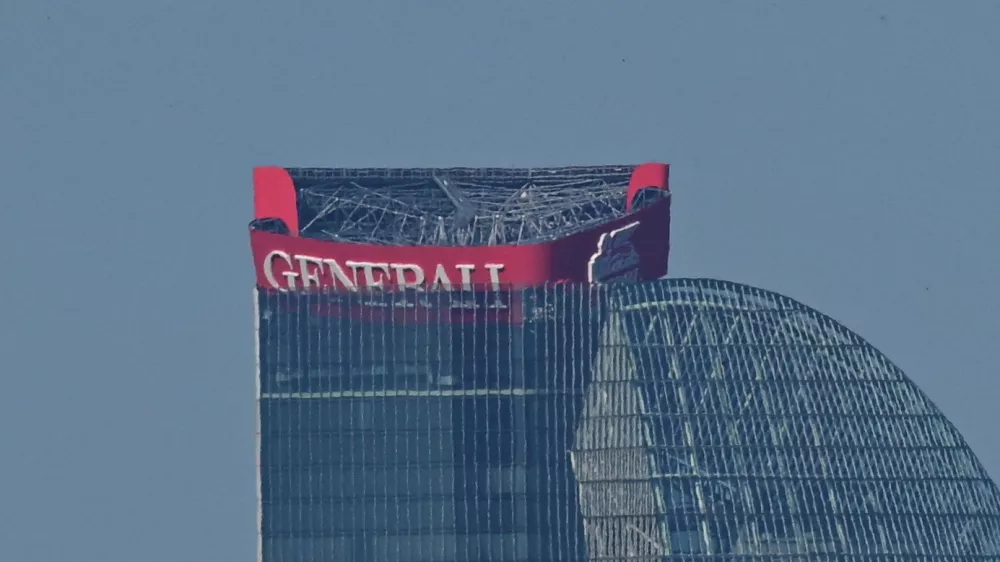 A partially collapsed sign of the Generali insurance headquarters is seen at the top of the Hadid tower in Milan, Italy, June 30, 2025. REUTERS/Daniele Mascolo