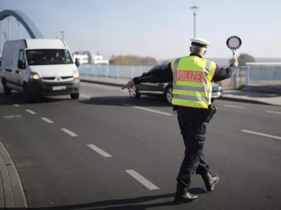 FILE - A officer of German Federal Police stops a van to search for immigrants at the border crossing from Poland into Germany in Frankfurt an der Oder, Germany, Oct. 28, 2021. Germany will increase its police patrols along "smuggling routes" on the border with Poland the Czech Republic in an effort to prevent more migrants from entering the country, it was announced Wednesday, Sept. 27, 2023. (AP Photo/Markus Schreiber, File)