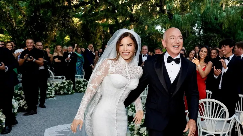 Amazon Founder Jeff Bezos and Media Personality Lauren Sanchez Bezos react on the day of their wedding in Venice, Italy, June 27, 2025 in this picture obtained from social media. @laurensanchezbezos via Instagram/via REUTERS THIS IMAGE HAS BEEN SUPPLIED BY A THIRD PARTY. MANDATORY CREDIT. NO RESALES. NO ARCHIVES.   TPX IMAGES OF THE DAY