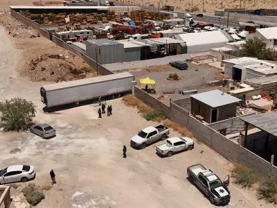 A drone view shows authorities working at a crematorium where they found bodies piled up in unsanitary conditions, after local funeral homes hired its services for cremation, according to the Chihuahua State Prosecutor's Office, in Ciudad Juarez, Mexico June 30, 2025. REUTERS/Jose Luis Gonzalez