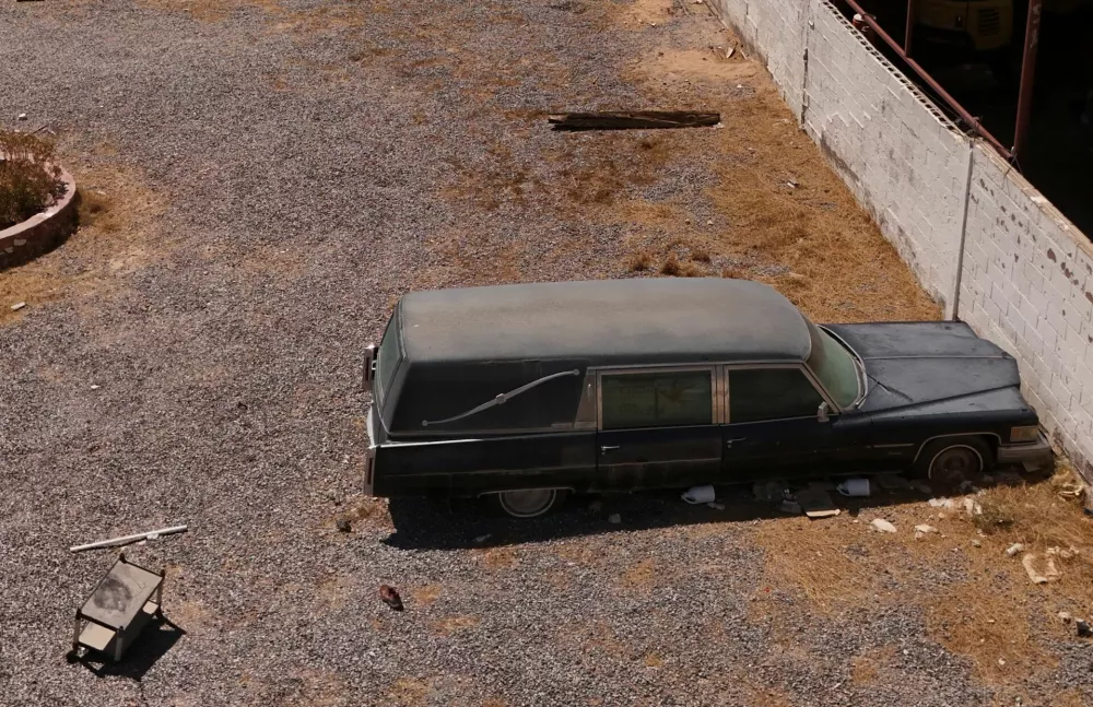 A drone view shows a hearse at a crematorium where authorities found bodies piled up in unsanitary conditions, according to the Chihuahua State Prosecutor's Office, in Ciudad Juarez, Mexico June 30, 2025. REUTERS/Jose Luis Gonzalez