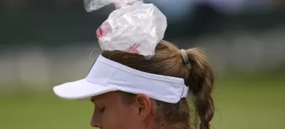 Veronika Erjavec of Slovenia uses an ice bag during her first round women's singles match against Marta Kostyuk of Ukraine at the Wimbledon Tennis Championships in London, Tuesday, July 1, 2025.(AP Photo/Kirsty Wigglesworth)
