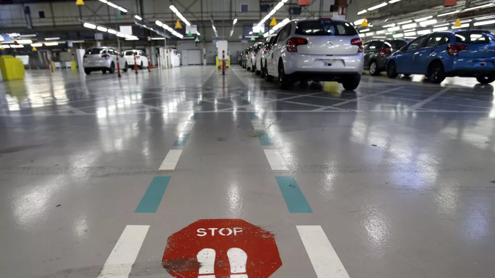 ﻿FILE - This Jan.28 2013 file photo, shoiws the French car manufacturer PSA Peugeot Citroen assembly line in Aulnay-sous-Bois, north of Paris. The maker of Peugeot and Citroen cars hopes to lay off 1,300 people this year and hire another 1,300 under new labor rules championed by President Emmanuel Macron to give companies more flexibility to hire and fire. PSA is among the first big companies to apply the new rules, which came into effect this month(AP Photo/Christophe Ena, File)