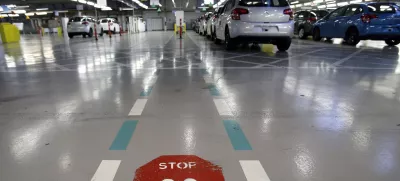 ﻿FILE - This Jan.28 2013 file photo, shoiws the French car manufacturer PSA Peugeot Citroen assembly line in Aulnay-sous-Bois, north of Paris. The maker of Peugeot and Citroen cars hopes to lay off 1,300 people this year and hire another 1,300 under new labor rules championed by President Emmanuel Macron to give companies more flexibility to hire and fire. PSA is among the first big companies to apply the new rules, which came into effect this month(AP Photo/Christophe Ena, File)