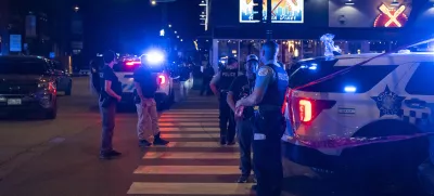 Chicago police investigate the scene of a shooting that took place at Artis Restaurant and Lounge located on Chicago Avenue in the River North neighborhood, Thursday, July 3, 2025. (Tyler Pasciak LaRiviere/Chicago Sun-Times via AP)