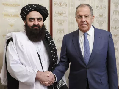 FILE - In this photo released by Russian Foreign Ministry Press Service on Oct. 4, 2024, Russian Foreign Minister Sergey Lavrov, right, and Acting Foreign Minister of Afghanistan's Taliban movement Amir Khan Muttaqi pose for a photo prior to their talks in Moscow, Russia. (Russian Foreign Ministry Press Service via AP, File)