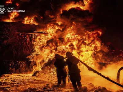 In this photo provided by the Ukrainian Emergency Service, emergency services personnel work to extinguish a fire following a Russian attack in Kharkiv region, Ukraine, Saturday, July 5, 2025. (Ukrainian Emergency Service via AP)