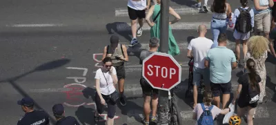 Serbian police officers guard an intersection after removing street blockades that were set up as part of a protest after a massive rally demanding an early parliamentary election in Belgrade, Serbia, Saturday, July 5, 2025. (AP Photo/Darko Vojinovic)