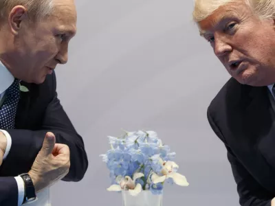 FILE – Then-U.S. President Donald Trump, right, meets with Russian President Vladimir Putin at the G20 Summit in Hamburg, Germany, Friday, July 7, 2017. (AP Photo/Evan Vucci, File)