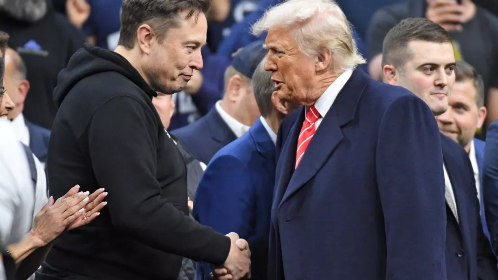 FILE PHOTO: Mar 22, 2025; Philadelphia, PA, USA; Elon Musk and President Donald Trump during the Division I Men's Wrestling Championship held at Wells Fargo Center. Mandatory Credit: Eric Hartline-Imagn Images/File Photo
