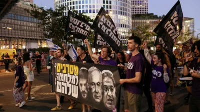 FILE PHOTO: Demonstrators hold a banner featuring images of Israeli Prime Minister Benjamin Netanyahu, Finance Minister Bezalel Smotrich and National Security Minister Itamar Ben-Gvir, during a protest to demand the immediate release of hostages held in Gaza since the October 7, 2023 attack on Israel by Hamas, in Tel Aviv, Israel, July 5, 2025. REUTERS/Ronen Zvulun/File Photo