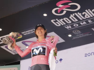 Switzerland's Marlen Reusser wears the pink jersey of the race overall leader after completing the 1st stage of the Giro d'Italia women's cycling race, from Bergamo to Bergamo, Italy Sunday, July 6, 2025. (Massimo Paolone/LaPresse via AP)
