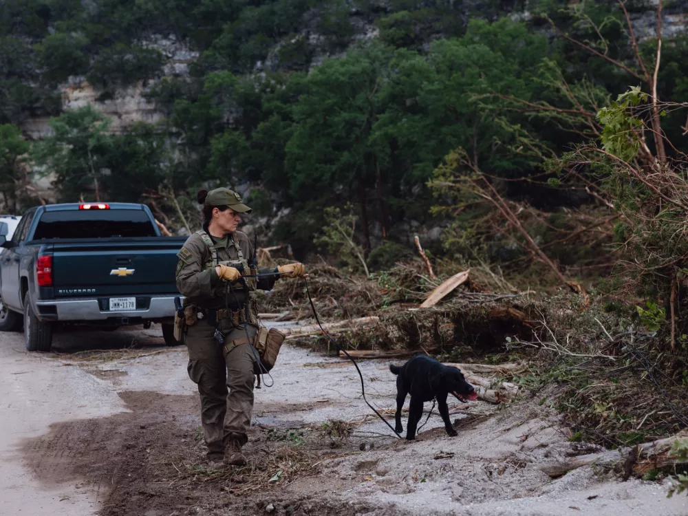 05 July 2025, US, IngramA K9 unit with the Texas Game Warden conducts searches in flood damaged areas next to Camp Mystic in Hunt. PhotoSan Antonio Express-News/Express-News via ZUMA Press Wire/dpa