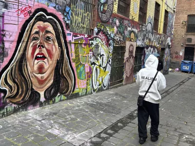 A likeness of Erin Patterson is painted on a wall in Melbourne, Australia, on June 28, 2025. (AP Photo/Rod McGuirk)