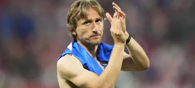 Croatia's Luka Modric waves supporters at the end of a Group B match between Croatia and Italy at the Euro 2024 soccer tournament in Leipzig, Germany, Monday, June 24, 2024. (AP Photo/Ebrahim Noroozi)