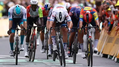 Cycling - Tour de France - Stage 3 - Valenciennes to Dunkirk - Dunkirk, France - July 7, 2025 Soudal Quick-Step's Tim Merlier crosses the finish line to win stage 3 REUTERS/Sarah Meyssonnier