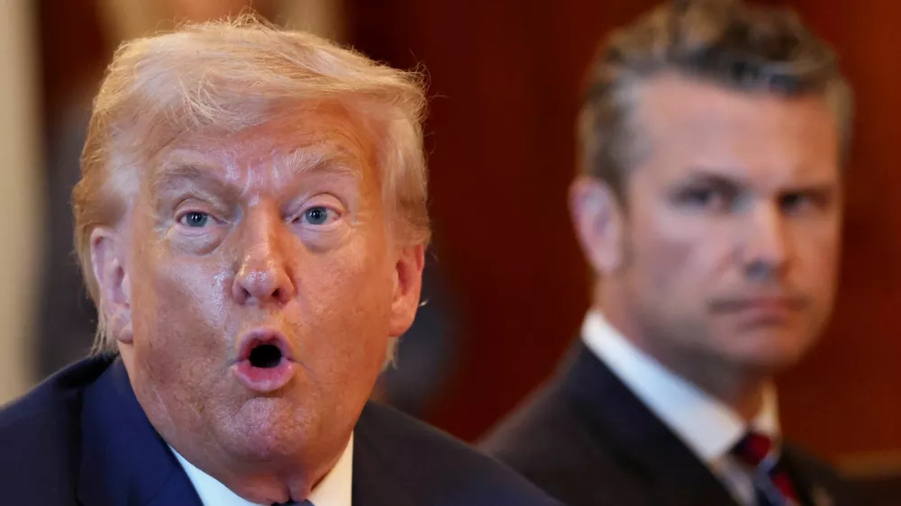 U.S. Defense Secretary Pete Hegseth looks at U.S. President Donald Trump as he speaks during a bilateral dinner with Israeli Prime Minister Benjamin Netanyahu (not pictured), at the White House in Washington, D.C., U.S., July 7, 2025. REUTERS/Kevin Lamarque   TPX IMAGES OF THE DAY