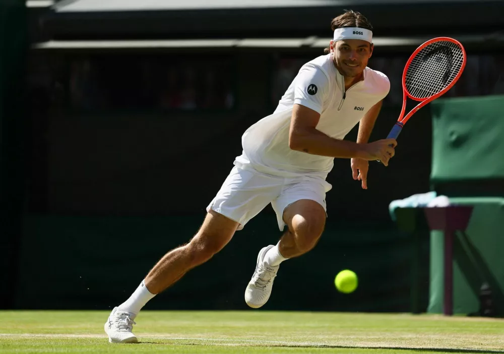 Tennis - Wimbledon - All England Lawn Tennis and Croquet Club, London, Britain - July 8, 2025 Taylor Fritz of the U.S. in action during his quarter final match against Russia's Karen Khachanov REUTERS/Isabel Infantes
