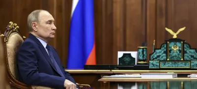 Russian President Vladimir Putin listens to Archpriest Alexander Tkachenko, Chairman of the Board of the Circle of Kindness Foundation and head of the commission for social partnership, trusteeship, and inclusive practices at the Russian Civic Chamber, at the Kremlin in Moscow, on Friday, May 30, 2025. (Alexander Kazakov, Sputnik, Kremlin Pool Photo via AP)