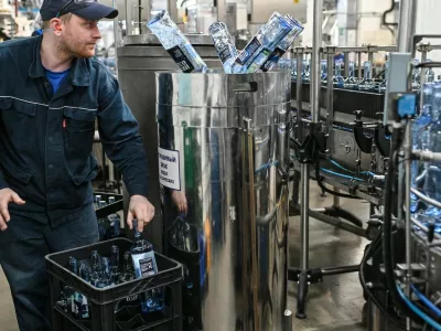 8378932 27.02.2023 Employees drain vodka from defective bottles at a production line of the Omskvinprom distillery in Omsk, Russia.,Image: 758980800, License: Rights-managed, Restrictions: Editors' note: THIS IMAGE IS PROVIDED BY RUSSIAN STATE-OWNED AGENCY SPUTNIK., Model Release: noFoto: Profimedia