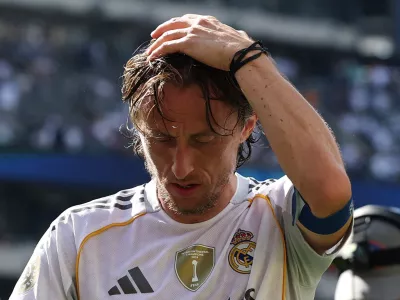 Soccer Football - FIFA Club World Cup - Semi Final - Paris St Germain v Real Madrid - MetLife Stadium, East Rutherford, New Jersey, U.S. - July 9, 2025 Real Madrid's Luka Modric reacts after the match REUTERS/Amanda Perobelli   TPX IMAGES OF THE DAY