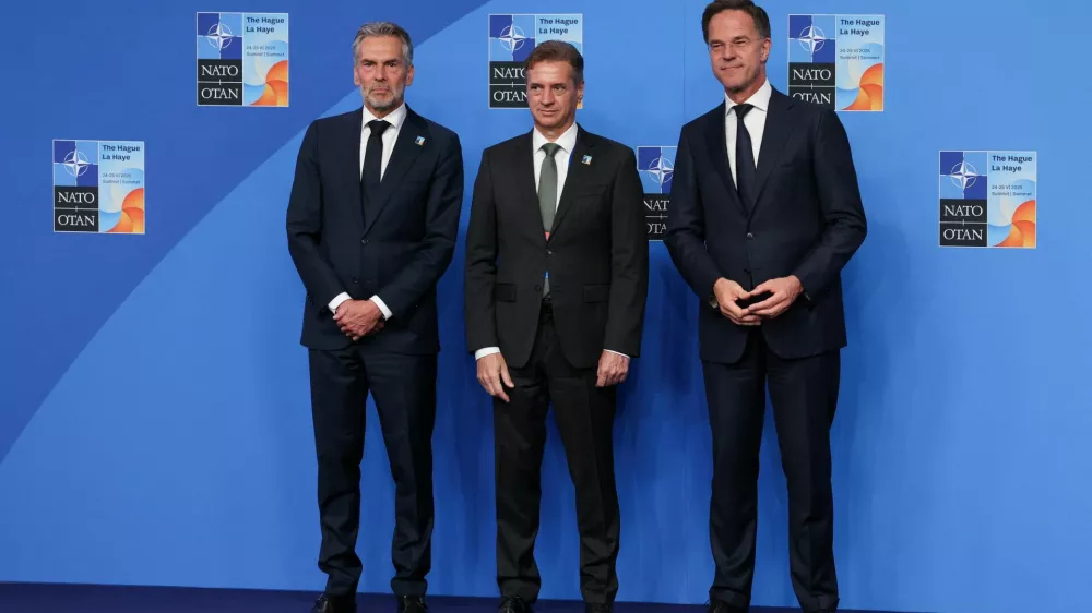 NATO Secretary General Mark Rutte and Dutch Prime Minister Dick Schoof welcome Slovenian Prime Minister Robert Golob at a NATO summit in The Hague, Netherlands June 25, 2025. REUTERS/Claudia Greco