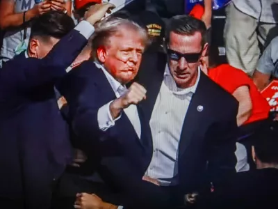 SCREENSHOT - 14 July 2024, US, Butler: Former US President Donald Trump is rushed off stage by secret service after being struck by gunfire during his Presidential Election campaign rally in Butler Pennsylvania. Photo: Artem Priakhin/SOPA Images via ZUMA Press Wire/dpa
