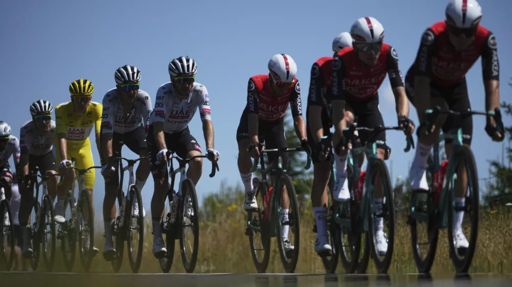 Slovenia's Tadej Pogacar wearing the overall leader's yellow jersey rides in the pack during the sixth stage of the Tour de France cycling race over 201.5 kilometers (125.2 miles) with start in Bayeux and finish in Vire Normandy, France, Thursday, July 10, 2025. (AP Photo/Thibault Camus)