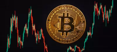 FILED - 21 November 2024, Berlin: A Bitcoin coin lies on a screen showing the Bitcoin - US dollar exchange rate. Photo: Fernando Gutierrez-Juarez/dpa