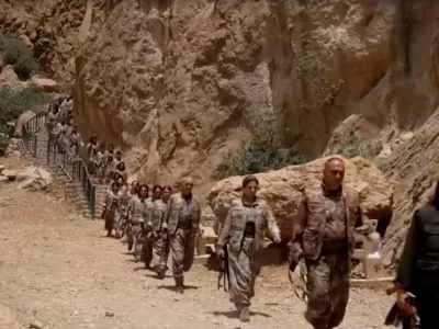 Armed PKK fighters arrive ahead of a disarming ceremony in Sulaimaniya, Iraq, July 11, 2025, in this?screengrab?obtained from a handout video. KURDISTAN WORKERS PARTY MEDIA OFFICE/Handout via REUTERS THIS IMAGE HAS BEEN SUPPLIED BY A THIRD PARTY