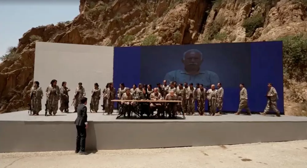 Armed PKK fighters arrive ahead of a disarming ceremony in Sulaimaniya, Iraq, July 11, 2025, in this?screengrab?obtained from a handout video. KURDISTAN WORKERS PARTY MEDIA OFFICE/Handout via REUTERS THIS IMAGE HAS BEEN SUPPLIED BY A THIRD PARTY