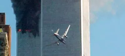 ﻿** ADVANCE FOR TUESDAY, NOV. 4, 2008 AND THEREAFTER ** FILE ** In this Sept. 11, 2001 file photo, a jet airliner nears one of the World Trade Center towers in New York. For all of the candidates' talk about the need for change, Americans have seen plenty of it since the last time they selected a new leader - including the attack on the World trade Center in 2001. (AP Photo/Carmen Taylor/File)