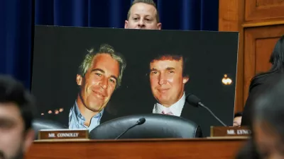 Rep. Jared Moskowitz (D-FL) holds up a photo of former U.S. President Donald Trump with late sex offender Jeffrey Epstein during a meeting of the the House Oversight and Accountability Committee to markup a resolution and report to hold Hunter Biden, President Joe Biden's son, in contempt of Congress, after he refused to appear for a closed-door deposition, at the Capitol in Washington, U.S., January 10, 2024. REUTERS/Kevin Lamarque