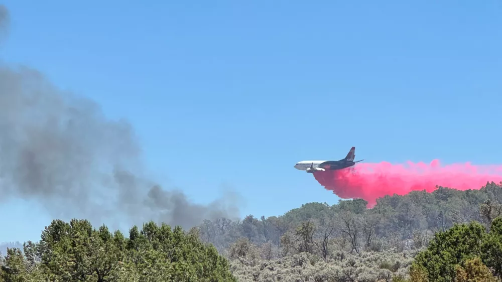 This photo provided by the Bureau of Land Management shows aerial resources working to suppress White Sage wildfire burning north of Grand Canyon National Park in Ariz., on Thursday, July 10, 2025. (Bureau of Land Management, Arizona State Office via AP)