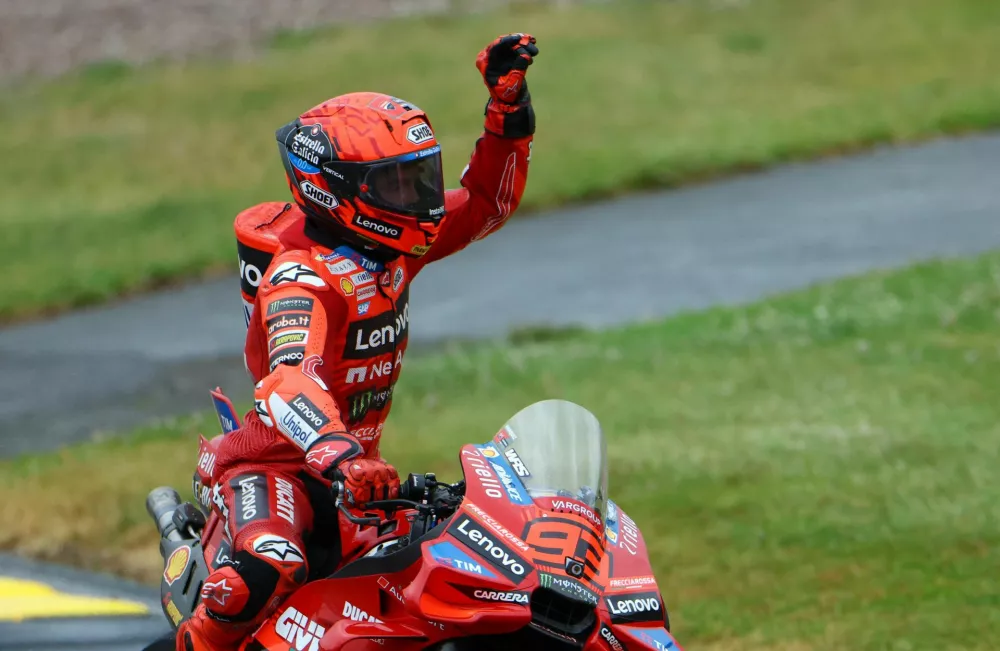 MotoGP - German Grand Prix - Sachsenring, Hohenstein-Ernstthal, Germany - July 12, 2025 Ducati Lenovo Team's Marc Marquez celebrates after winning the sprint race REUTERS/Lisi Niesner
