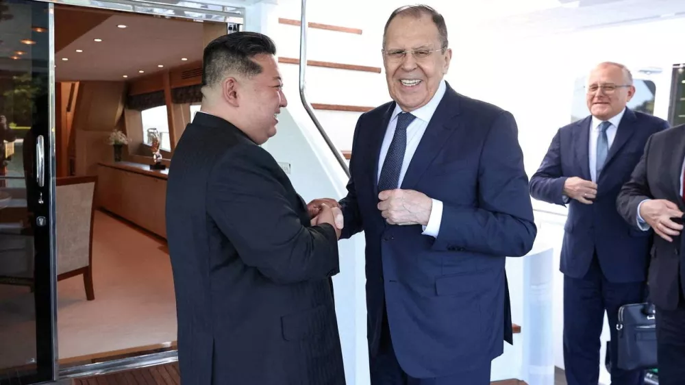 North Korean leader Kim Jong Un shakes hands with Russian Foreign Minister Sergei Lavrov during a meeting in Wonsan, North Korea July 12, 2025. Russian Foreign Ministry/Handout via REUTERS ATTENTION EDITORS - THIS IMAGE HAS BEEN SUPPLIED BY A THIRD PARTY. NO RESALES. NO ARCHIVES. MANDATORY CREDIT.   TPX IMAGES OF THE DAY