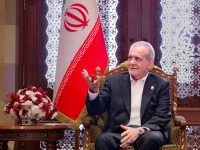 FILED - 28 May 2025, Oman, Muscat: Iran's President Masoud Pezeshkian speaks with Sayyid Fahd Bin Mahmoud Al-Said (not pictured), the Deputy Prime Minister for the Council of Ministers in the Sultanate of Oman as they meet in Muscat. Photo: --/Iranian Presidency/dpa - ATTENTION: editorial use only and only if the credit mentioned above is referenced in full