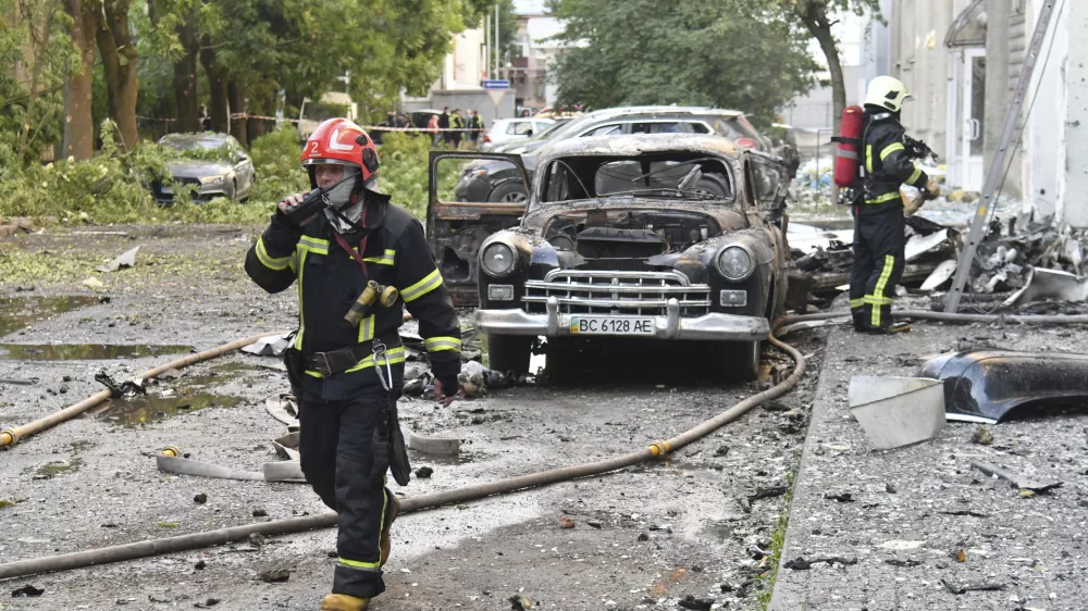 Firefighters work at the site of Russian air attack in Lviv, Ukraine, Saturday, July 12, 2025. (AP Photo/Mykola Tys)