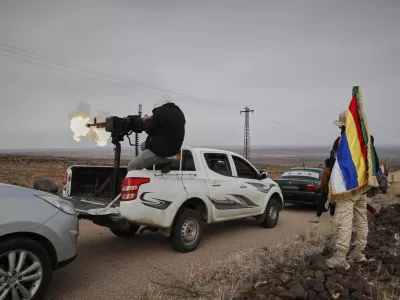 A Druze militiaman fires from a machine-gun attached on the back of a truck during a shooting practice in the southern province of Sweida, Syria, March 4, 2025. (AP Photo/Omar Sanadiki)